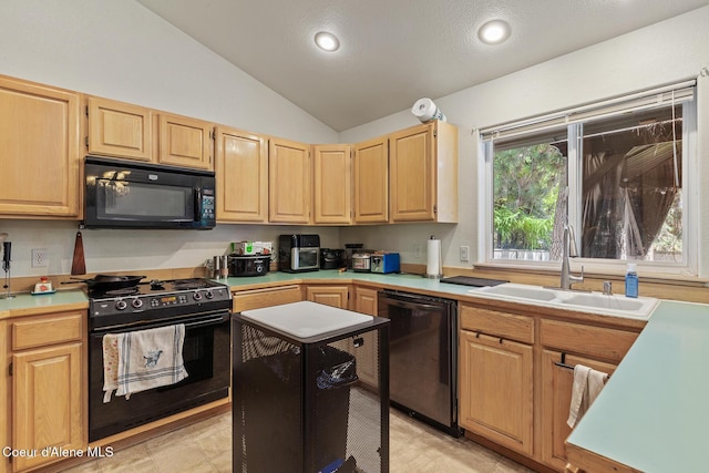kitchen featuring vaulted ceiling, a sink, light countertops, black appliances, and light brown cabinets