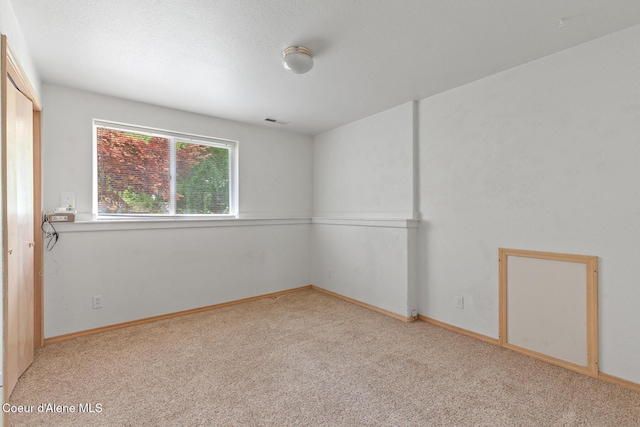 3868 N Palmer Dr, Coeur Dalene, ID 83815 - empty room featuring light carpet and baseboards
