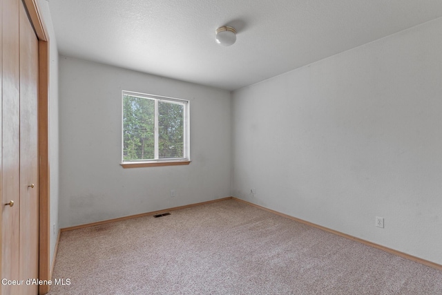 3868 N Palmer Dr, Coeur Dalene, ID 83815 - spare room featuring carpet and baseboards