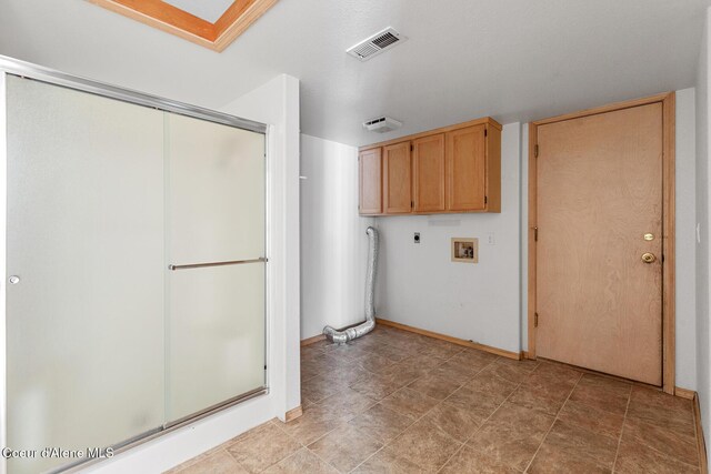 3868 N Palmer Dr, Coeur Dalene, ID 83815 - laundry room featuring cabinet space, electric dryer hookup, and hookup for a washing machine