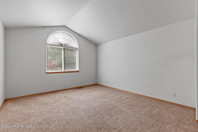 3868 N Palmer Dr, Coeur Dalene, ID 83815 - empty room featuring lofted ceiling and carpet