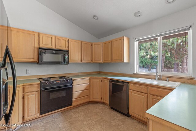 3868 N Palmer Dr, Coeur Dalene, ID 83815 - kitchen with black appliances, light brown cabinets, vaulted ceiling, light countertops, and recessed lighting