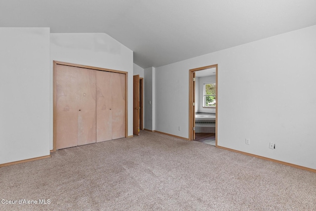 3868 N Palmer Dr, Coeur Dalene, ID 83815 - unfurnished bedroom featuring carpet flooring, lofted ceiling, connected bathroom, and a closet