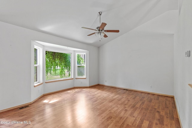 3868 N Palmer Dr, Coeur Dalene, ID 83815 - empty room featuring vaulted ceiling, wood finished floors, and ceiling fan