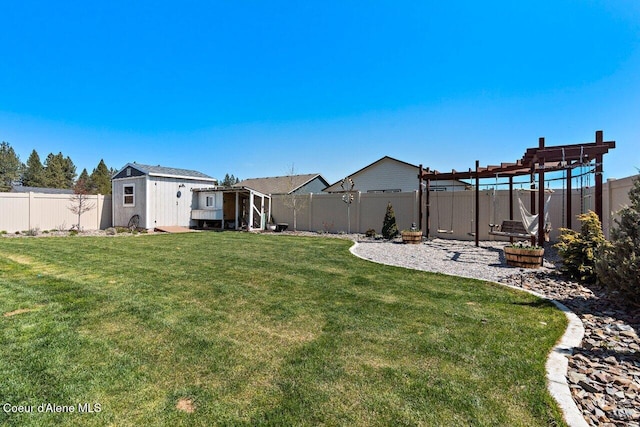 view of yard featuring a fenced backyard and an outdoor structure