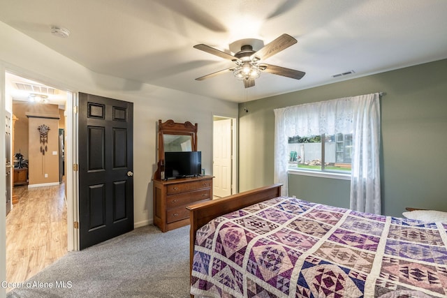 bedroom with visible vents and a ceiling fan