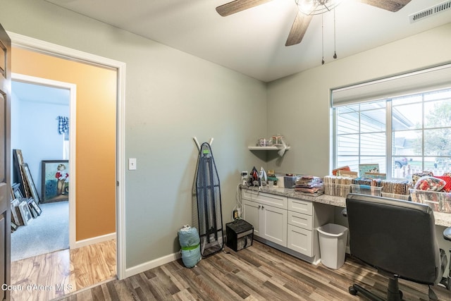 office with ceiling fan, baseboards, light wood-style flooring, and visible vents