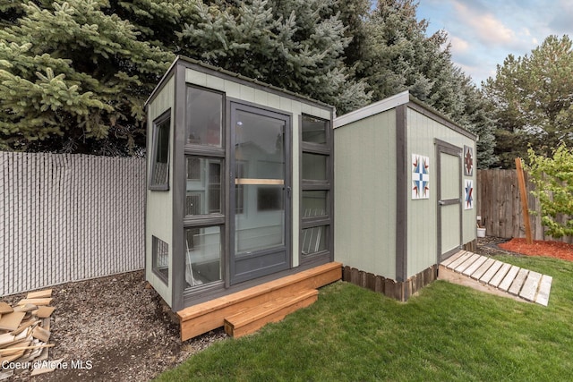 view of shed with a fenced backyard