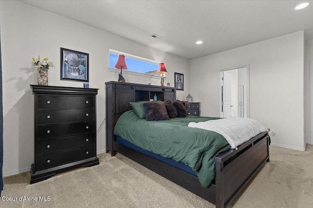 carpeted bedroom with recessed lighting, baseboards, and visible vents