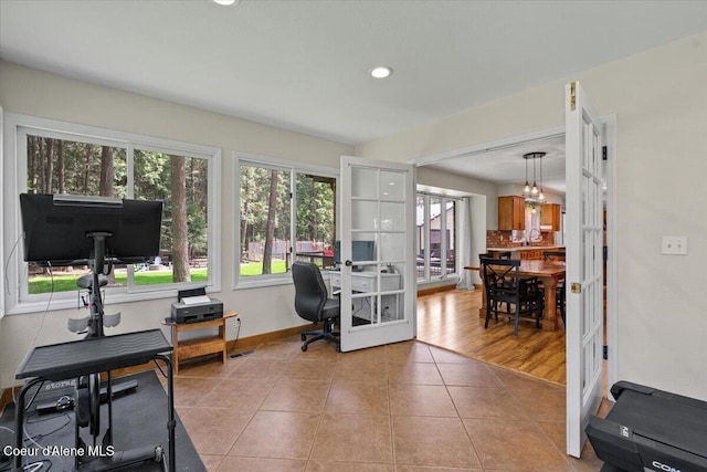tiled home office with a sink, baseboards, french doors, and recessed lighting
