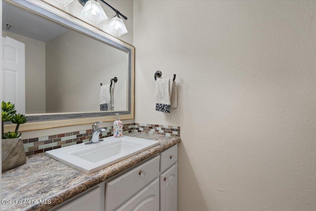 bathroom with vanity and backsplash
