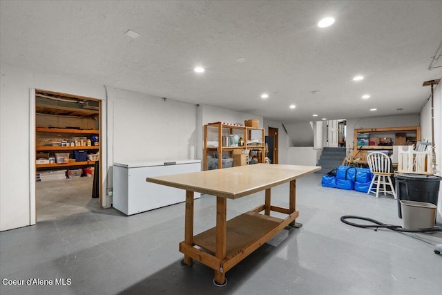 dining area featuring recessed lighting, a textured ceiling, and finished concrete flooring