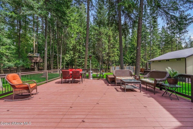 wooden terrace with outdoor lounge area