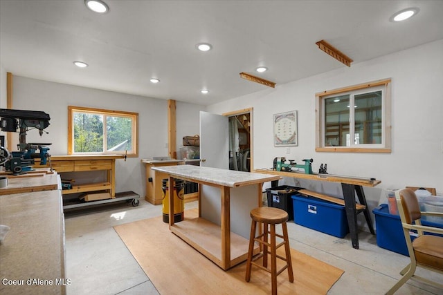 interior space with recessed lighting and light countertops