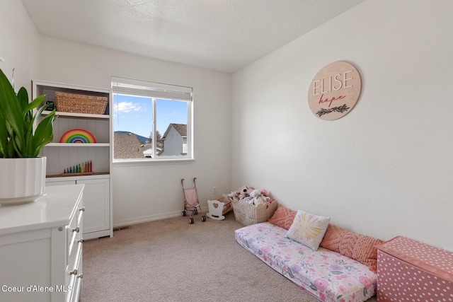 bedroom with baseboards, visible vents, and light colored carpet