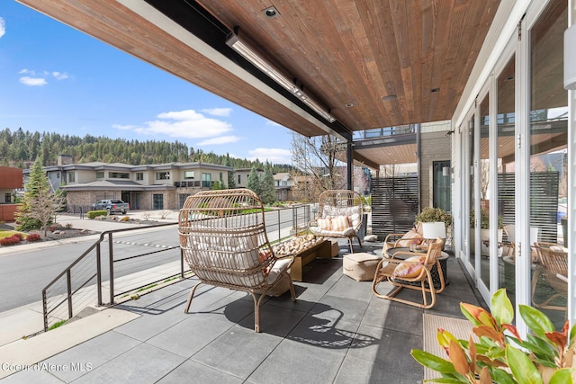 balcony featuring outdoor lounge area and a residential view