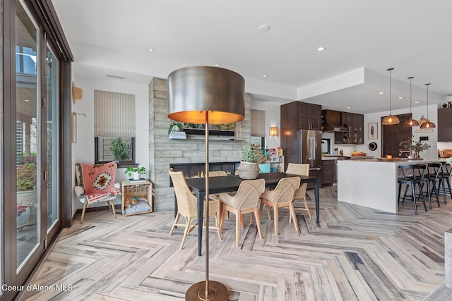 dining space featuring a fireplace
