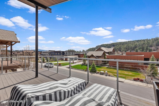 wooden terrace with a residential view