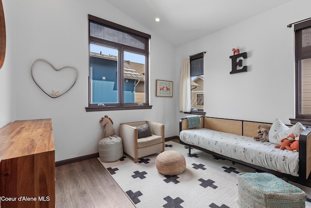 living area featuring wood finished floors, recessed lighting, vaulted ceiling, and baseboards