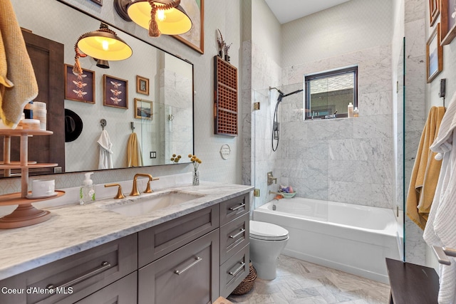 bathroom featuring washtub / shower combination, vanity, and toilet