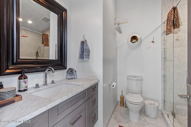 full bath with toilet, visible vents, a shower stall, and vanity