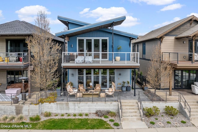 back of house with a balcony