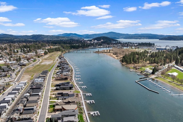 aerial view featuring a water and mountain view