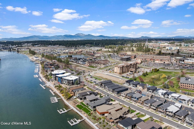 birds eye view of property featuring a water and mountain view