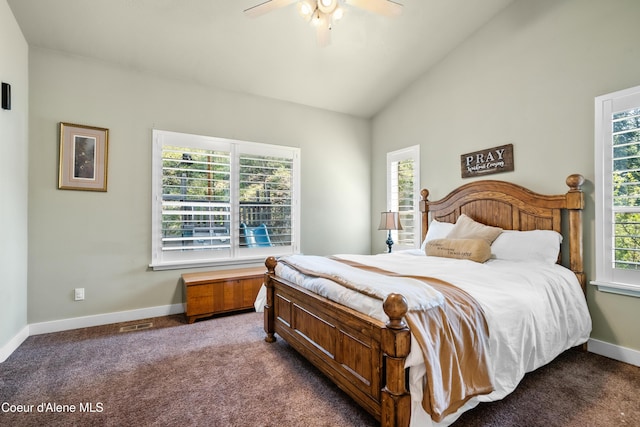 carpeted bedroom featuring baseboards, a ceiling fan, vaulted ceiling, and visible vents