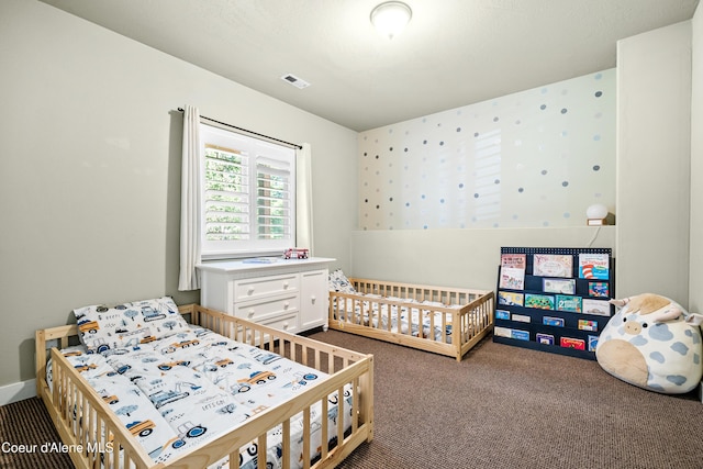 bedroom featuring carpet floors and visible vents