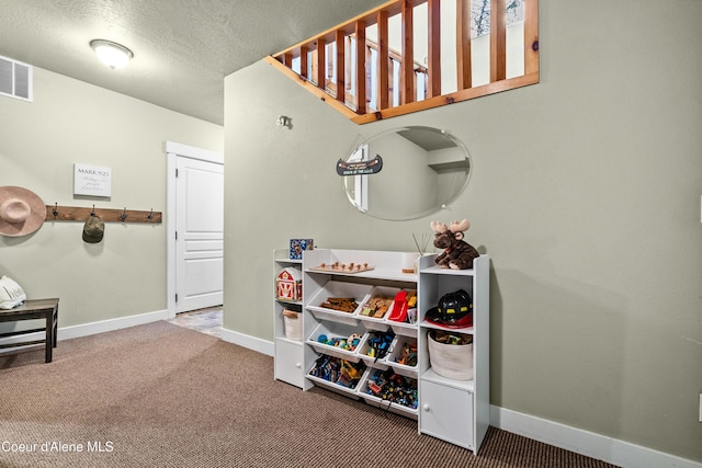 interior space featuring baseboards, carpet, and visible vents