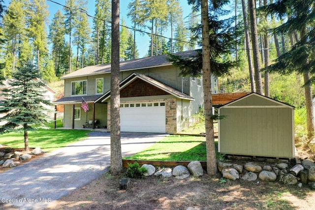 view of home's exterior featuring an outdoor structure, driveway, stone siding, a shed, and a yard
