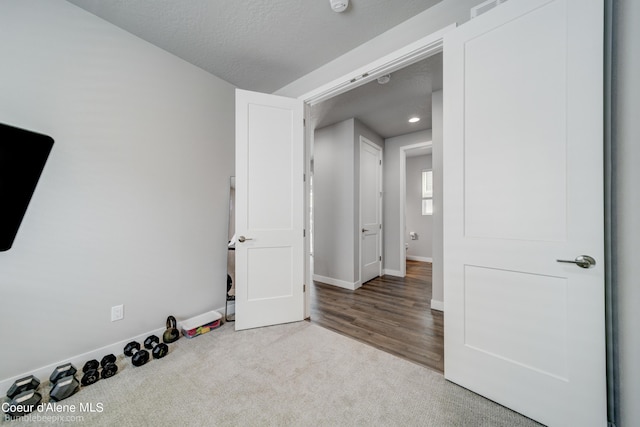 unfurnished bedroom with baseboards, carpet, recessed lighting, and visible vents