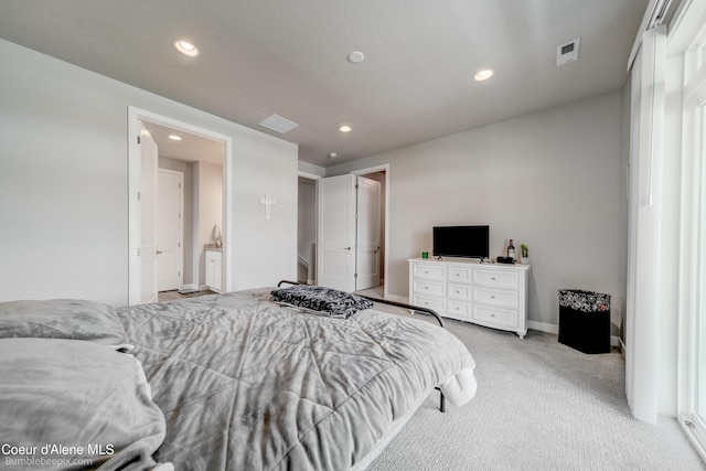 bedroom with recessed lighting, baseboards, and light carpet