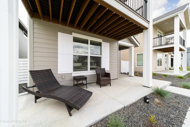 view of patio featuring a balcony