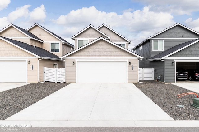 view of front of house featuring fence and driveway