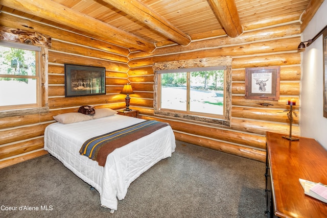bedroom featuring beamed ceiling, multiple windows, and wooden ceiling