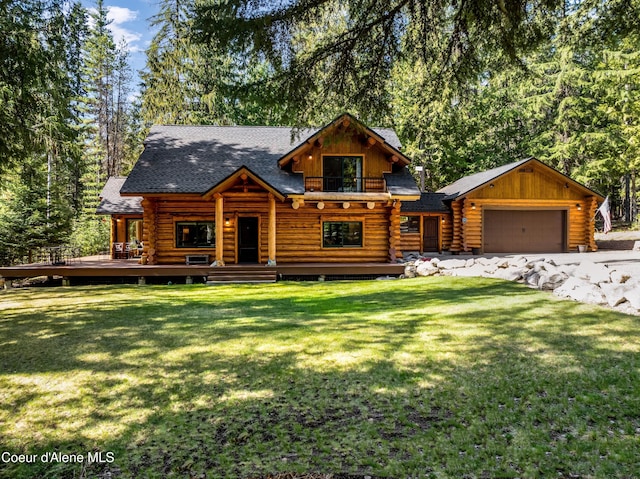 log cabin with a shingled roof, log siding, a front lawn, and a garage