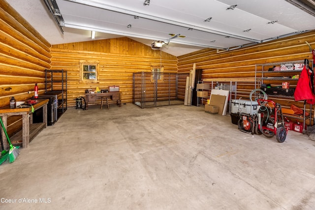 garage featuring a workshop area and a garage door opener