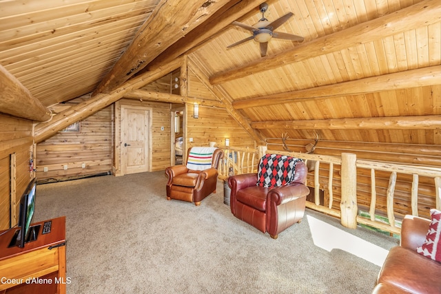 sitting room featuring a ceiling fan, wooden ceiling, wooden walls, vaulted ceiling with beams, and carpet flooring