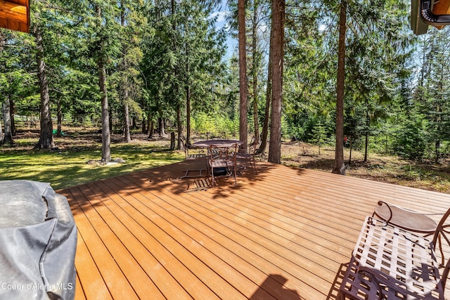 wooden terrace with outdoor dining area