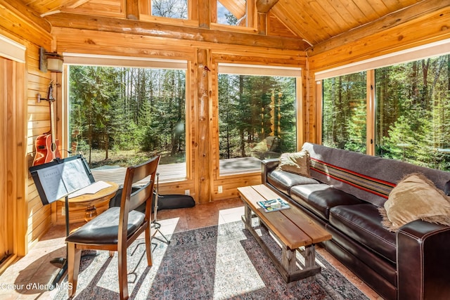 sunroom with wooden walls, wooden ceiling, and lofted ceiling