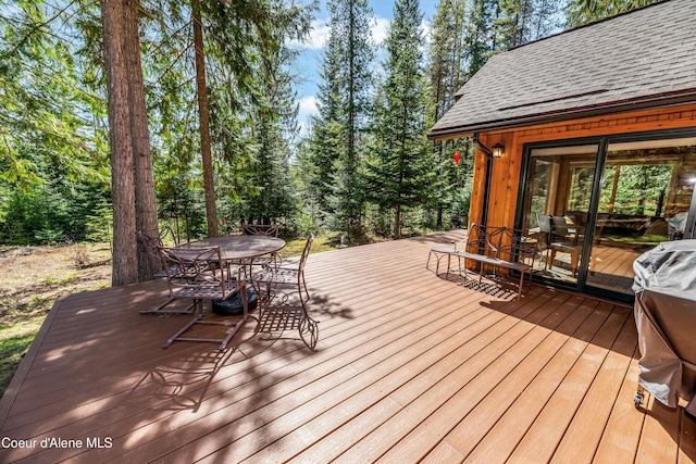 deck featuring outdoor dining area