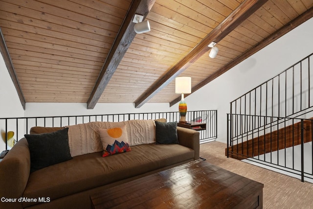 living area featuring lofted ceiling with beams and wooden ceiling