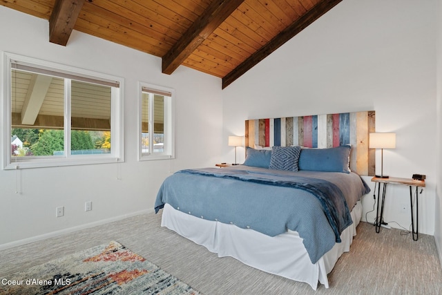 bedroom with baseboards, lofted ceiling with beams, carpet, and wooden ceiling