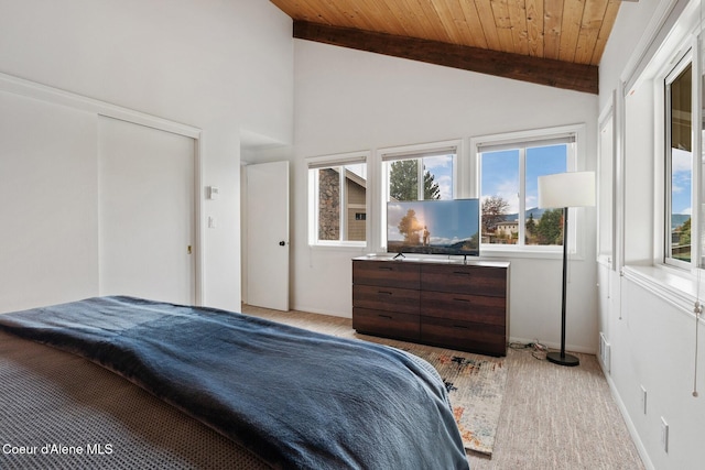 bedroom with wood ceiling, light carpet, lofted ceiling with beams, and visible vents