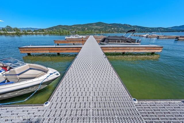 dock area with a water and mountain view