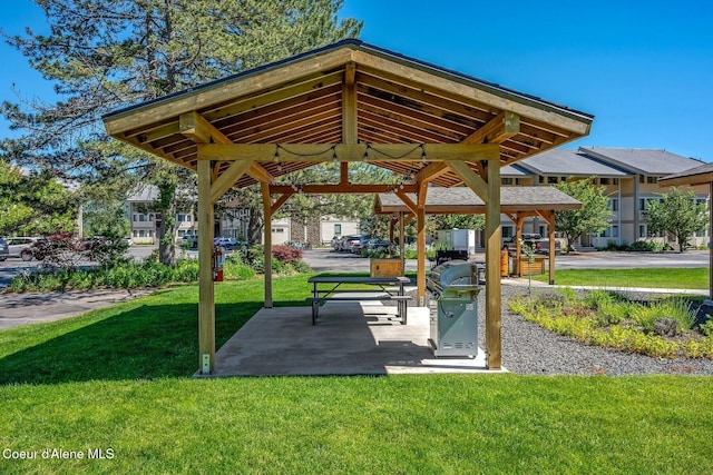 view of property's community with a yard and a gazebo