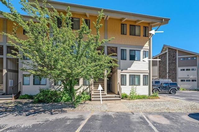 view of front of house with uncovered parking