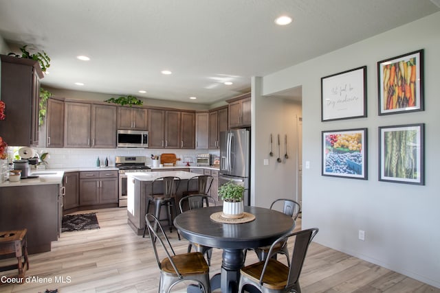 1733 N Minam Loop, Post Falls, ID 83854 - dining space with baseboards, recessed lighting, and light wood finished floors